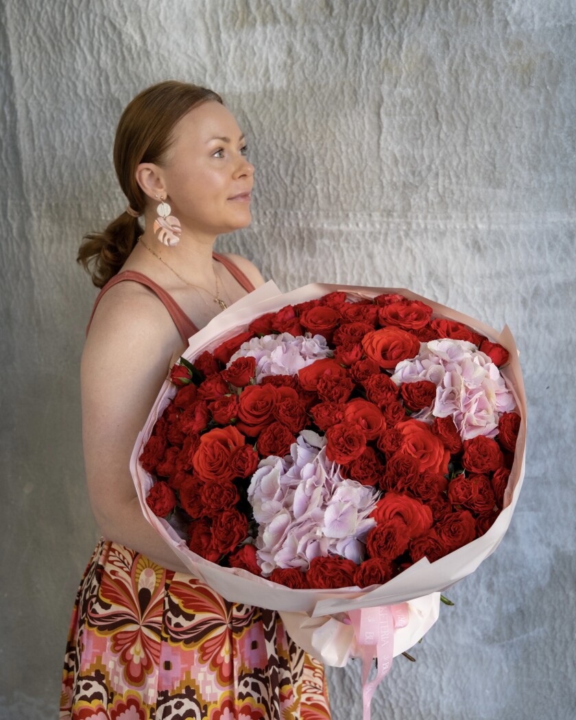 Thirty-three red spray roses with pink hydrangeas