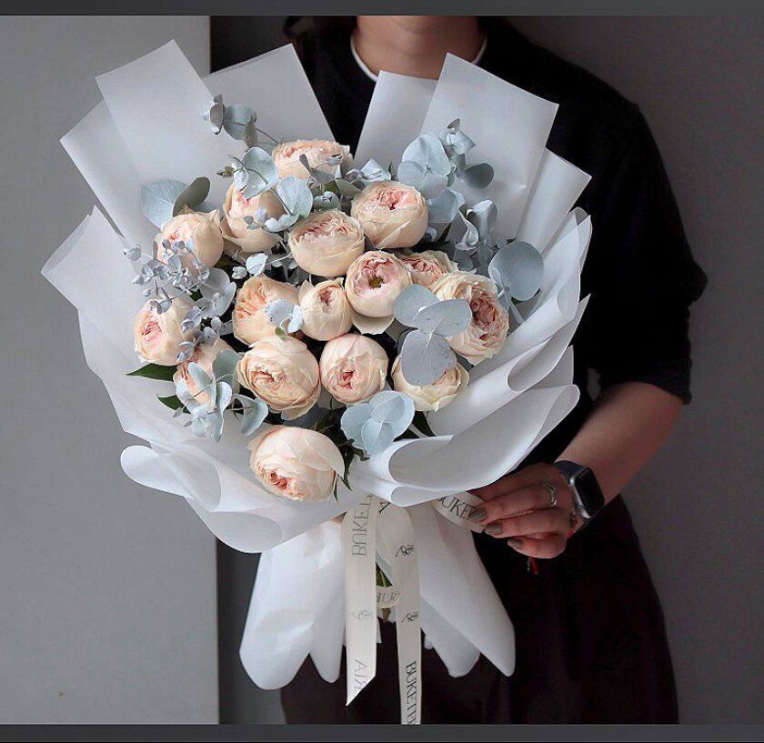 Peach spray roses in waterproof paper