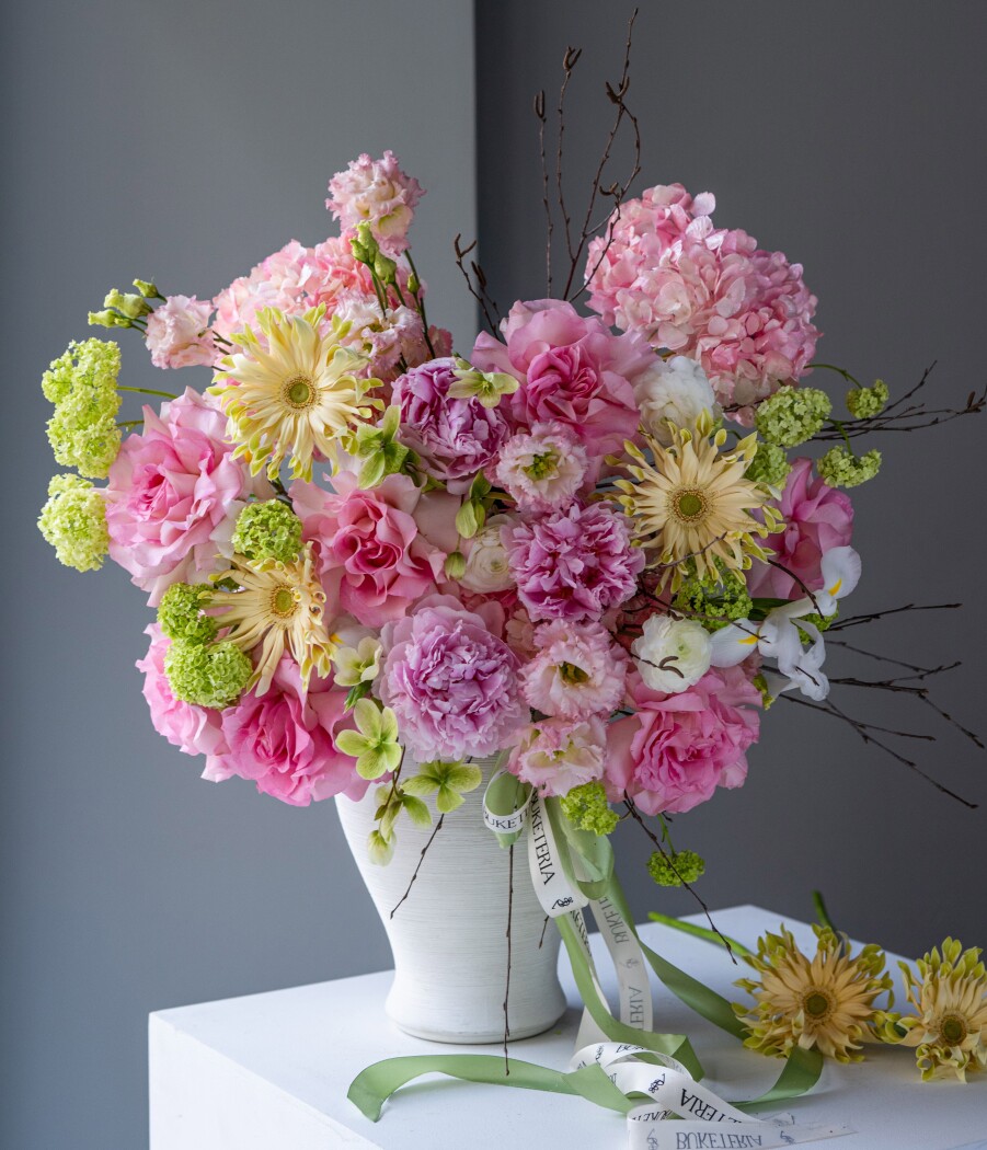 Three pink hydrangeas with blush garden roses and peonies