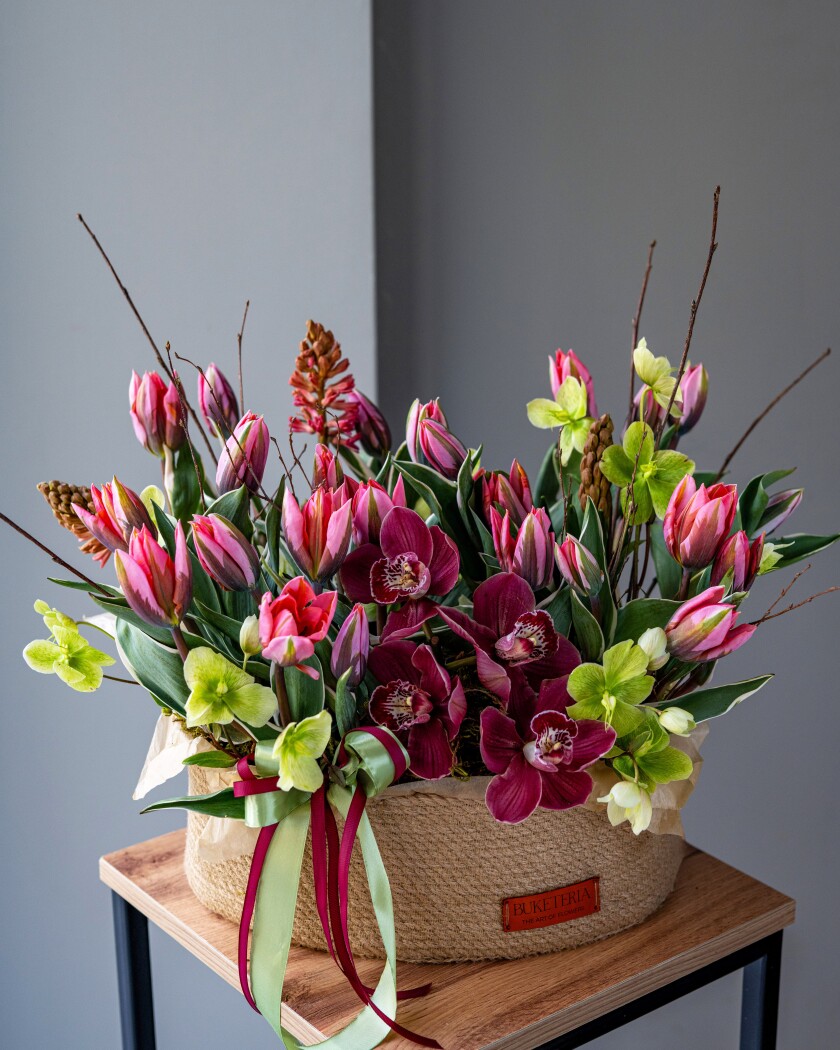 Coral tulips with wine hyacinths and burgundy orchids