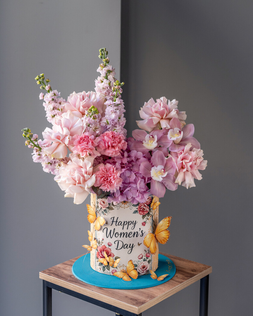 Decorative composition of blush garden roses and lavender stocks