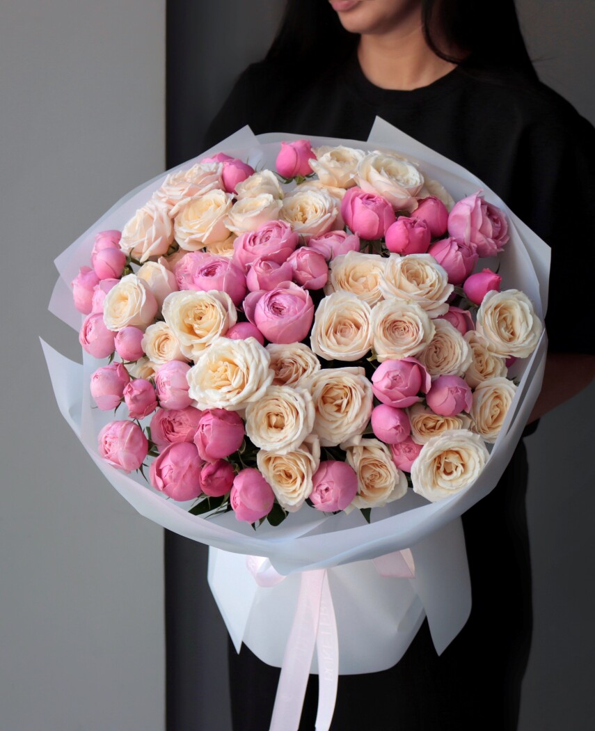 Light pink and cream spray roses in waterproof paper