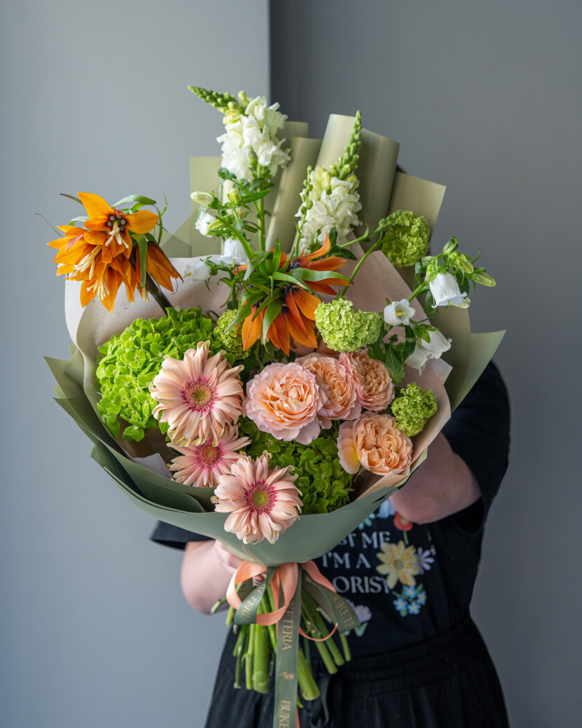 Mixed bouquet of orange fritillaria and green hydrangea