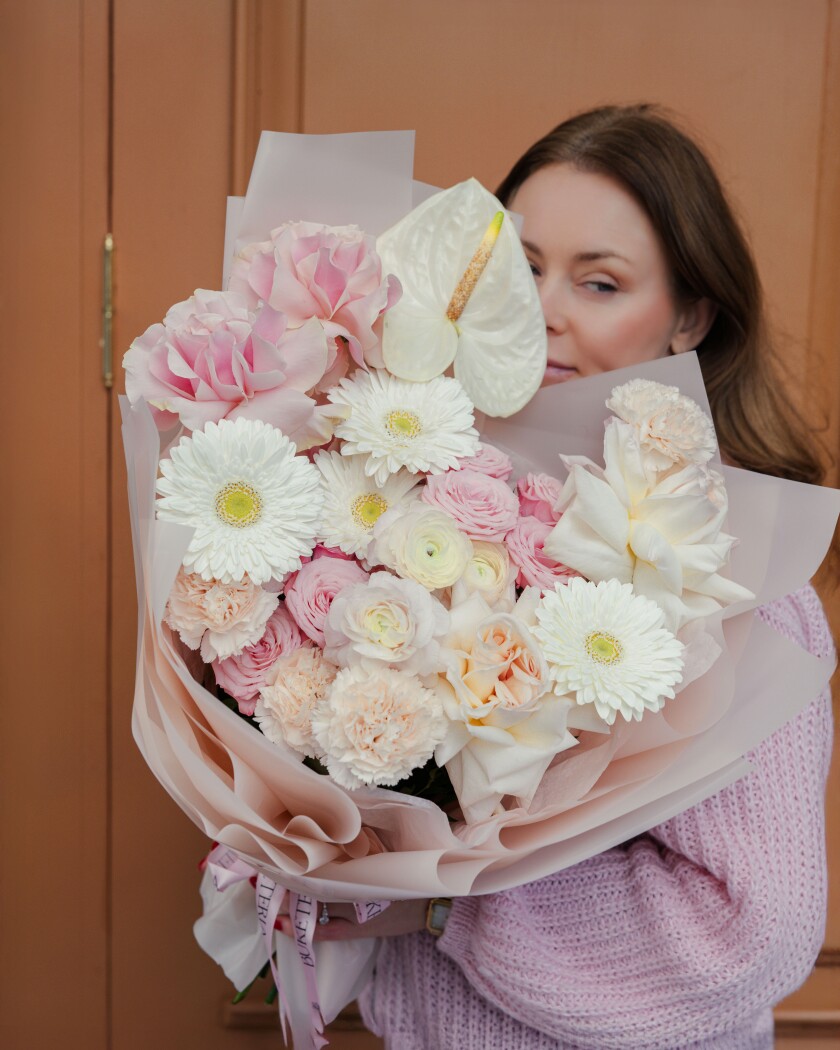 Light pink garden roses with apricot ranunculus and white gerberas