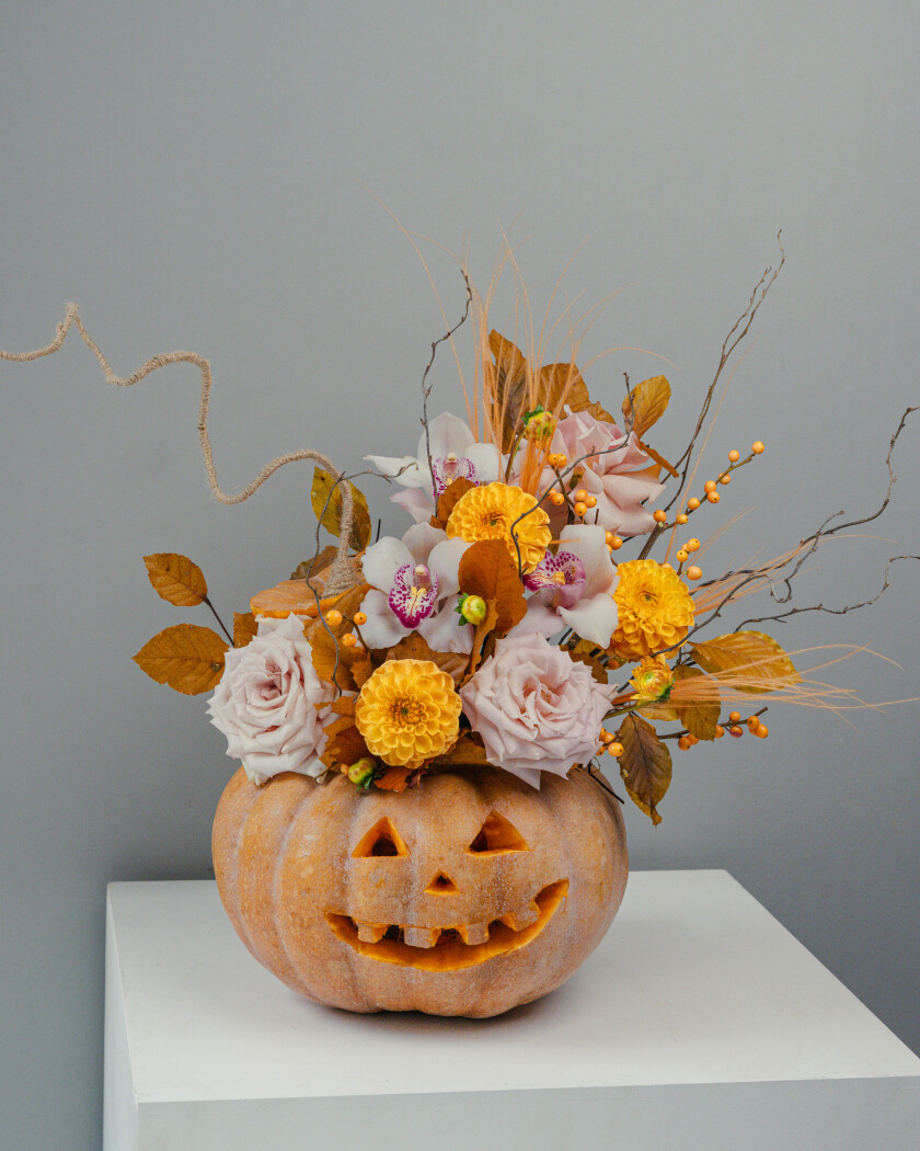 Yellow ball dahlias with white cymbidium orchids