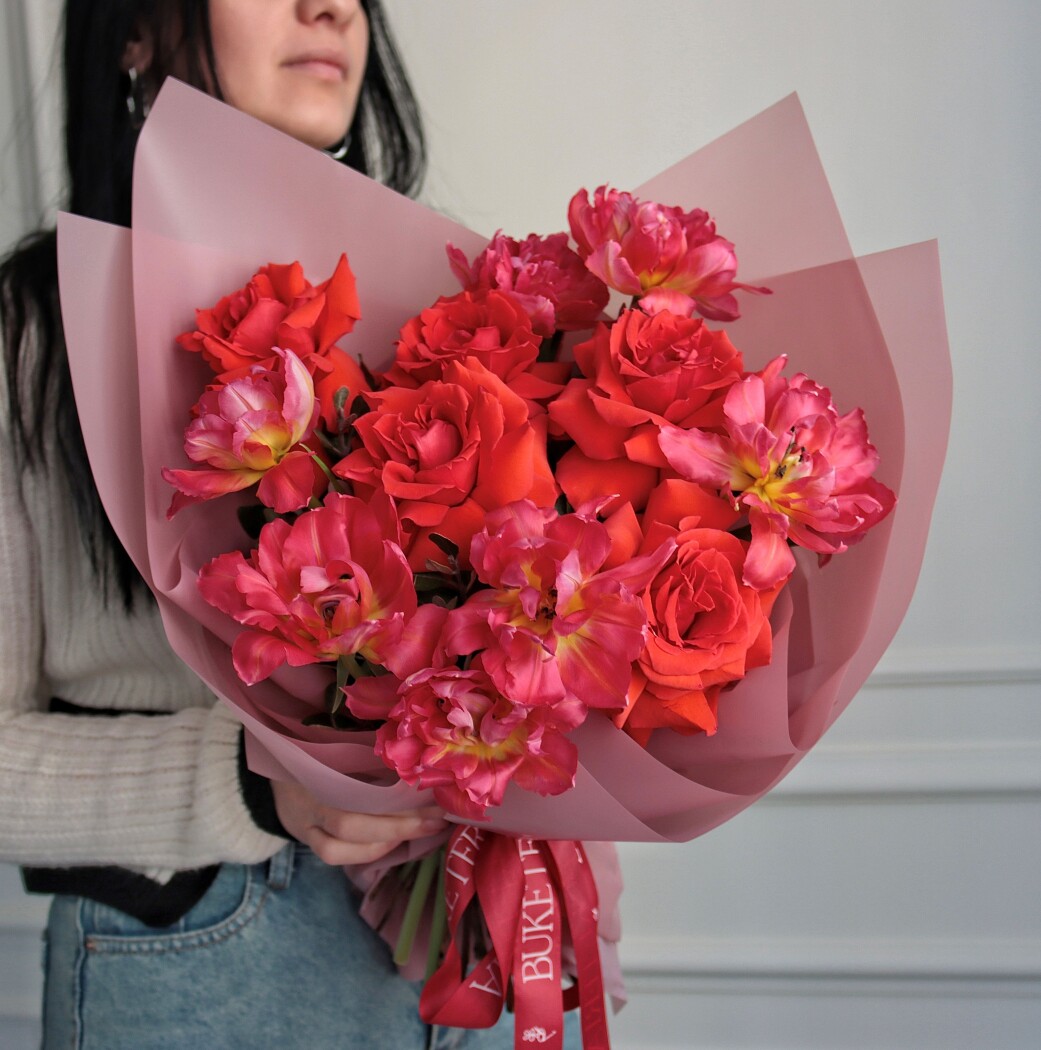 Seven pink double tulips and five red hybrid tea roses