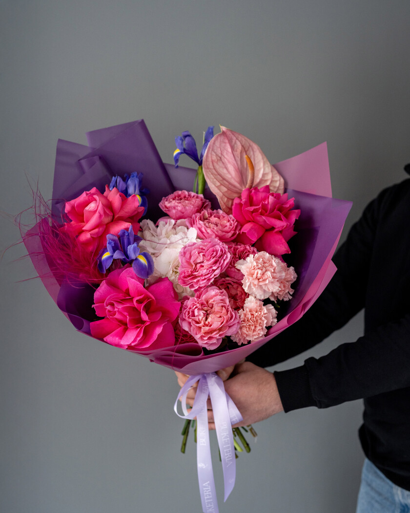 Three deep pink garden roses with light pink spray roses