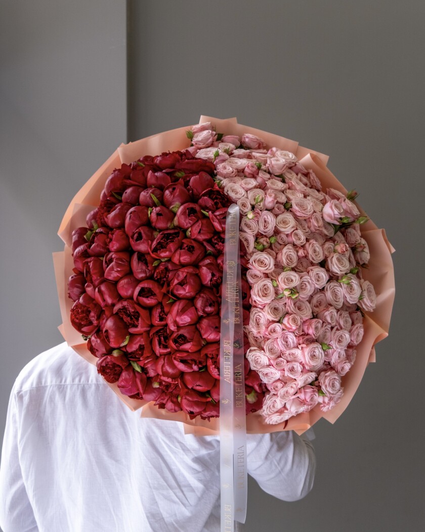 Red peonies with light pink spray roses
