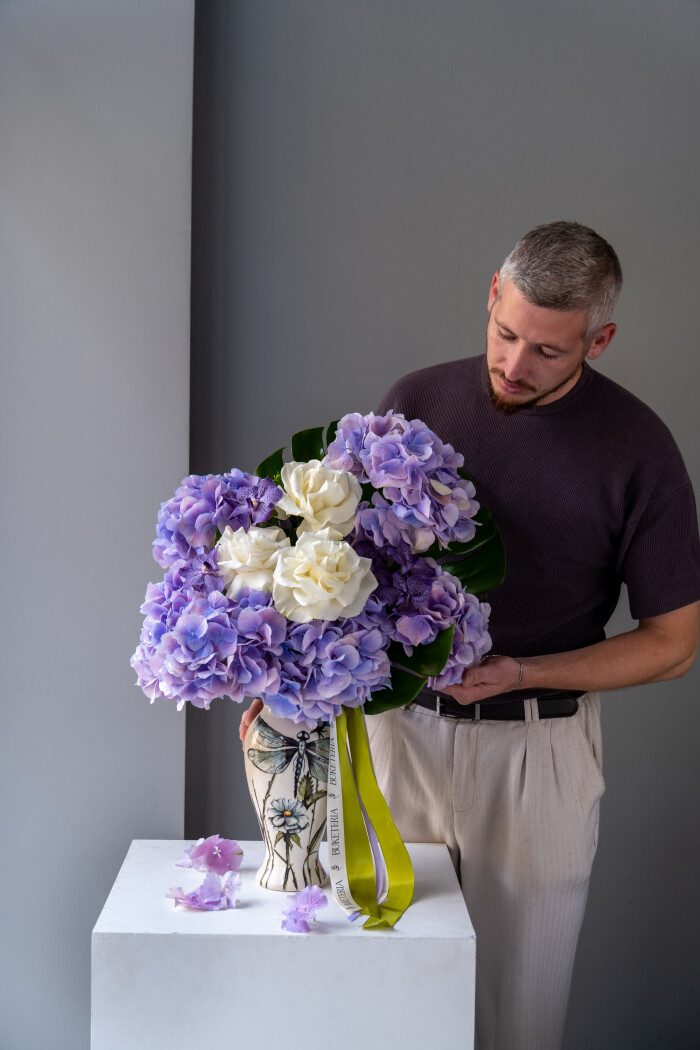 Lilac hydrangeas with lavender vanda orchids and white roses