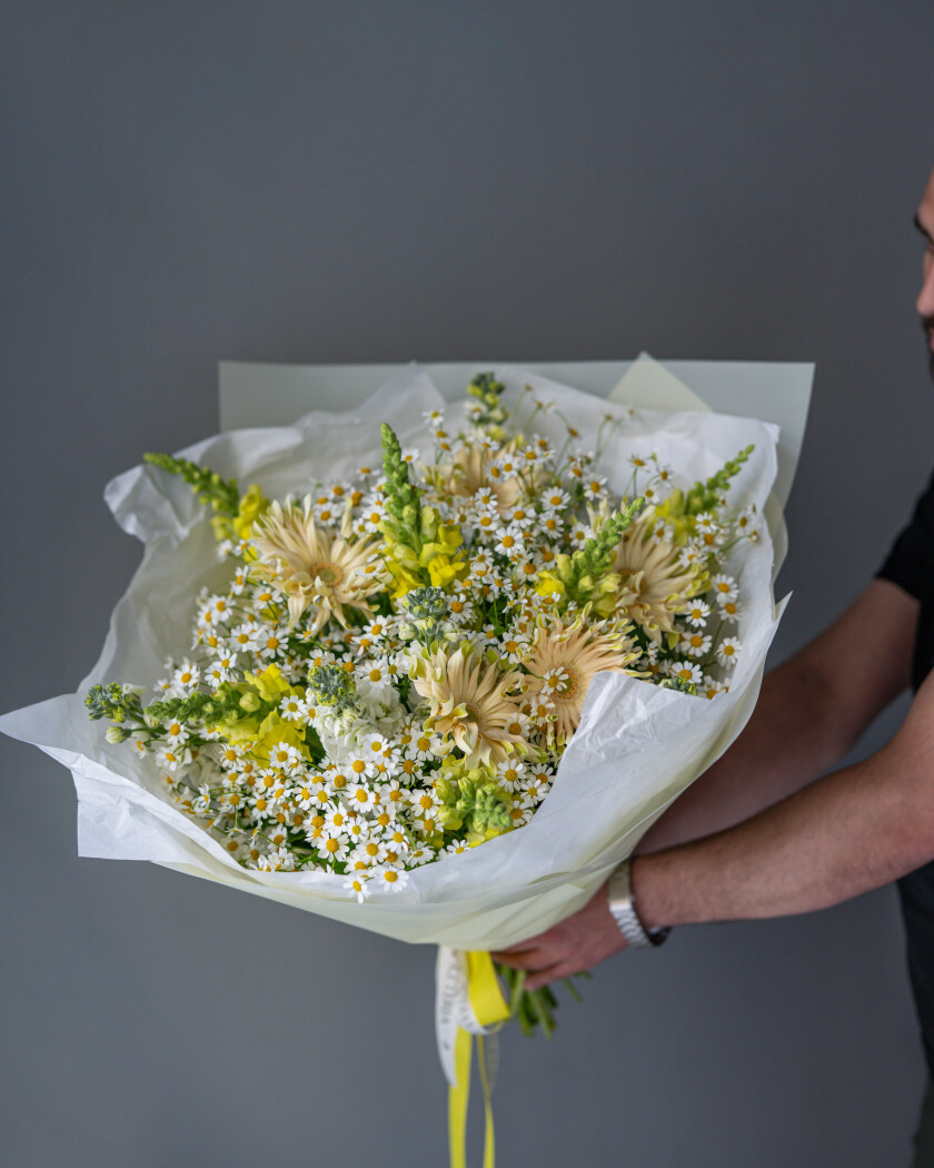 Mixed bouquet of cream gerberas, yellow stocks, and light green snapdragons