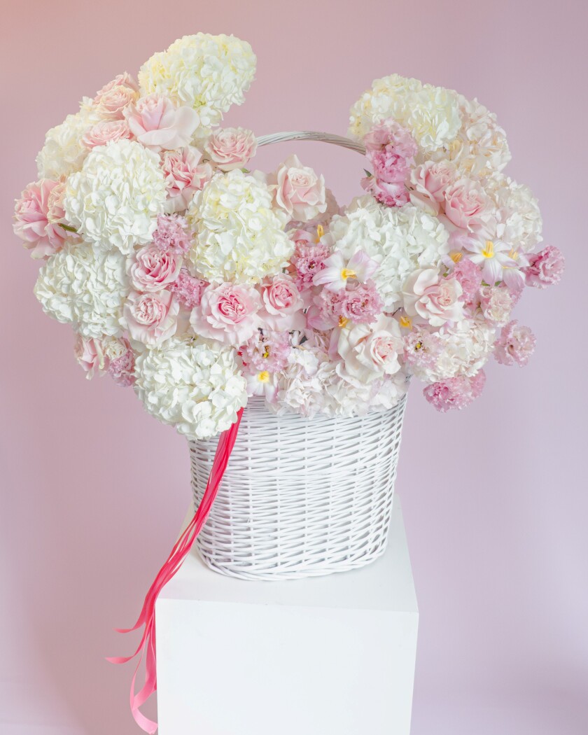 Decorative arrangement of white hydrangeas and pink garden roses