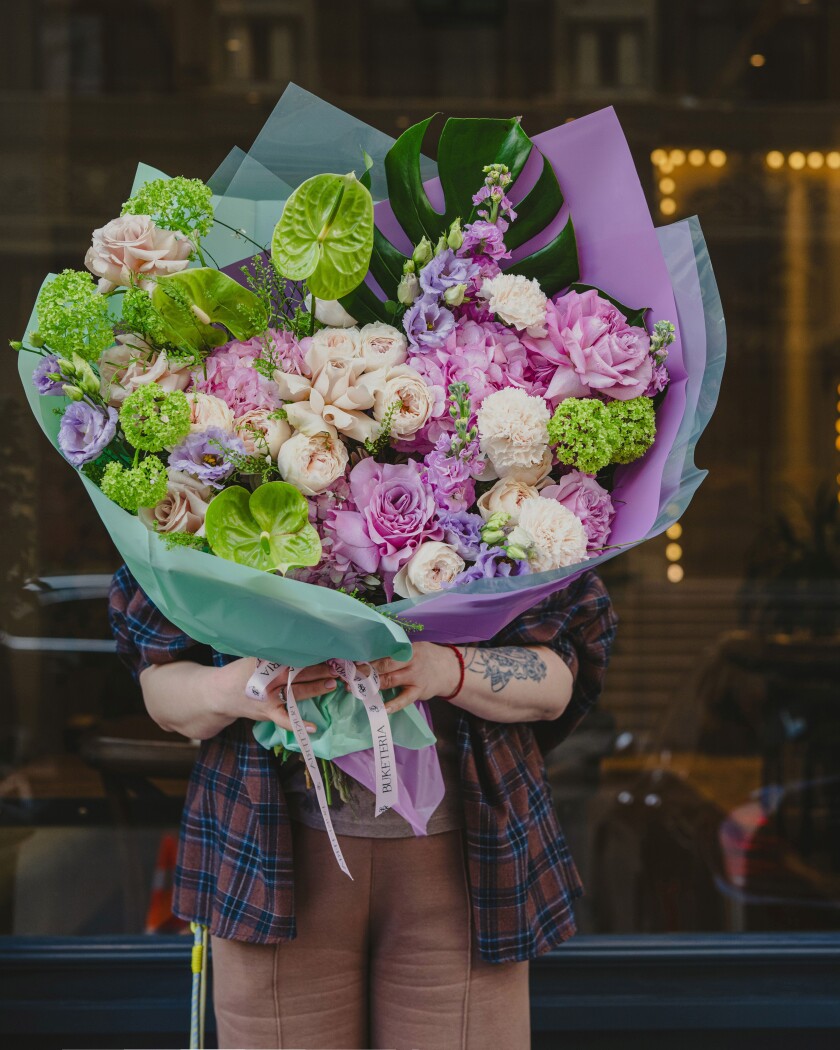 Three light blue hydrangeas with blush and cream garden roses