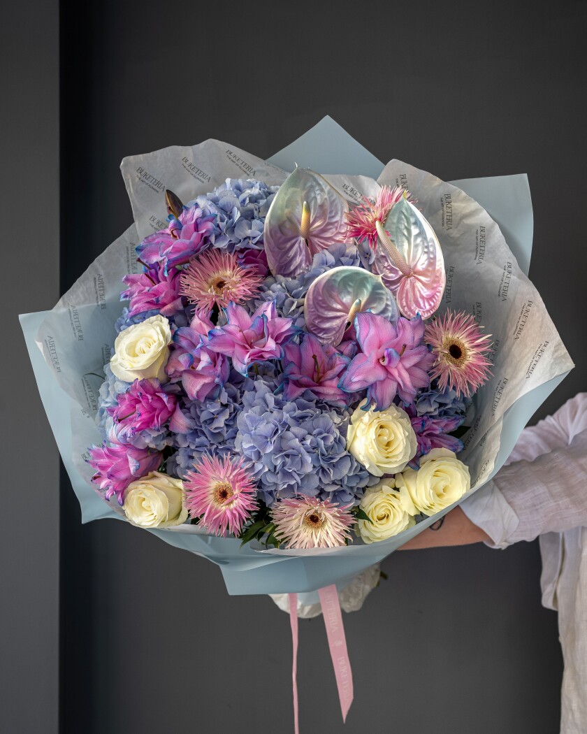Mixed bouquet of blue hydrangeas and pink anthuriums
