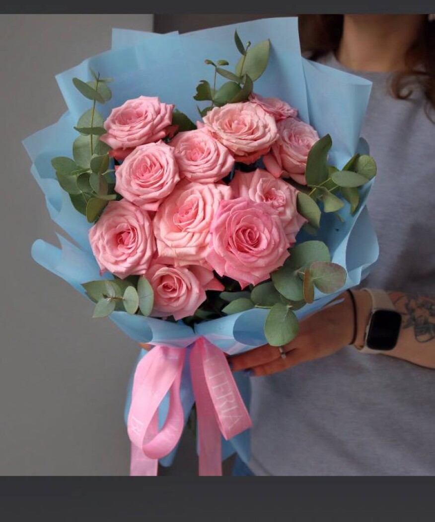 Three light pink spray roses in waterproof paper