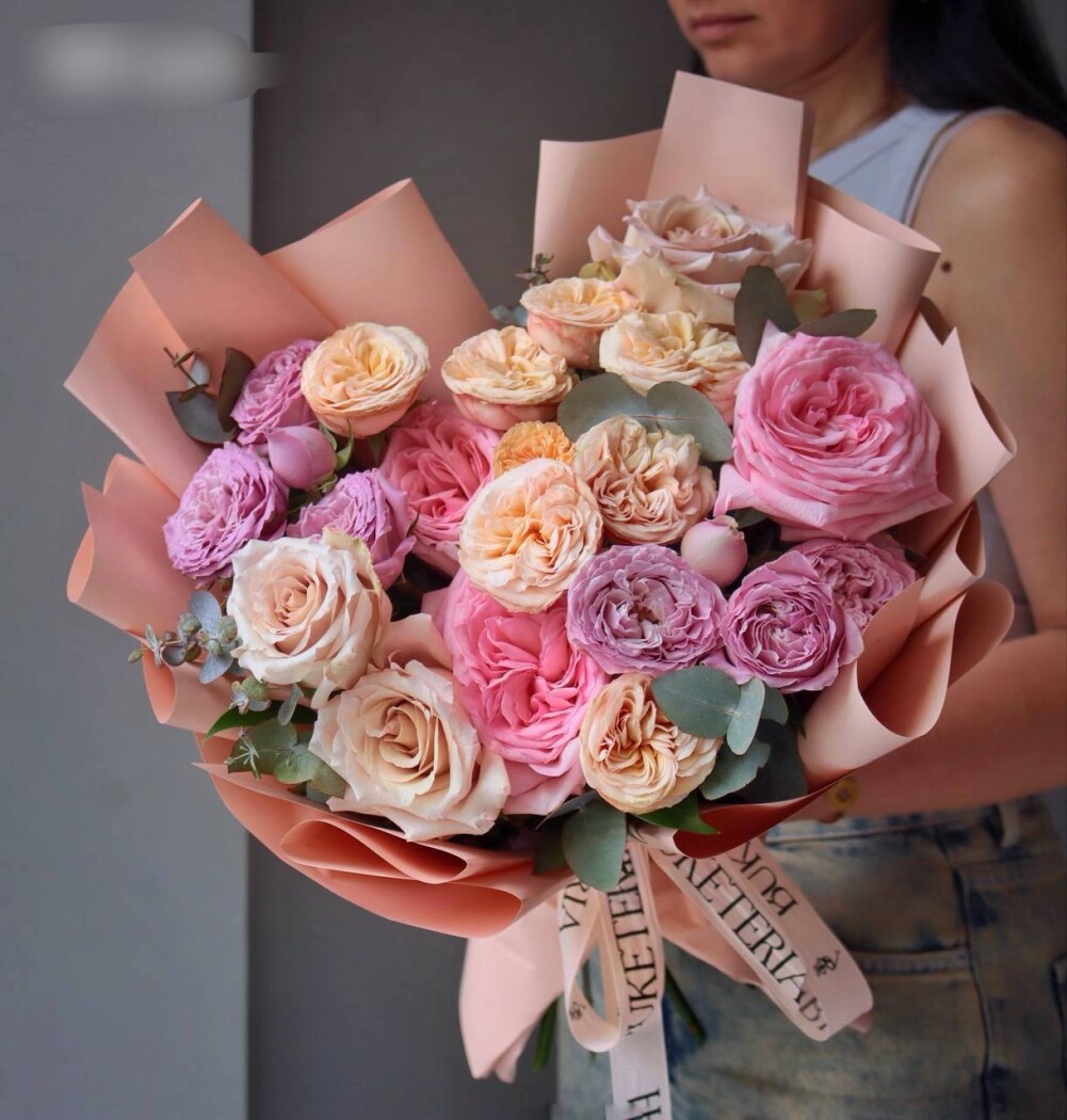 Peach and lavender garden roses with light pink spray roses