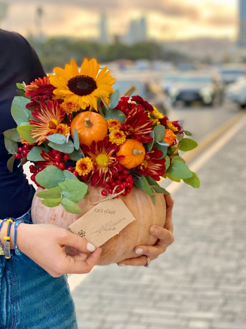 Yellow gerberas with burgundy garden roses and red carnations