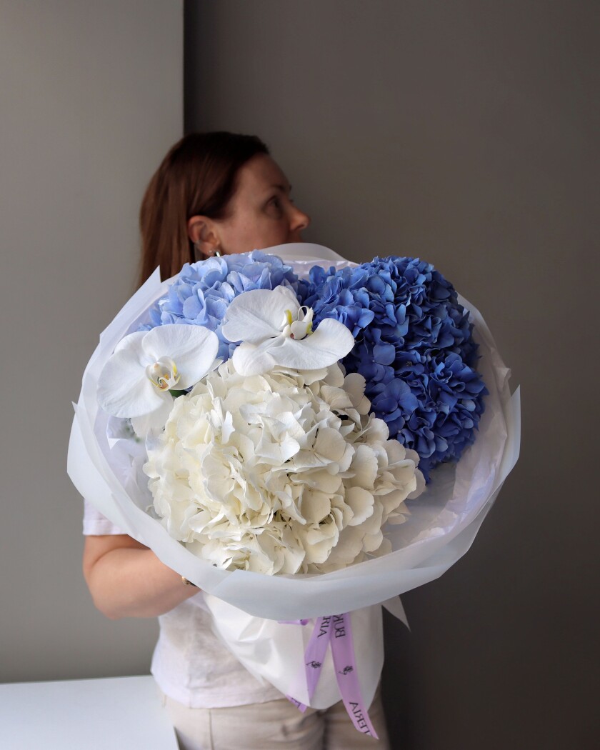 Blue hydrangeas with white phalaenopsis orchids