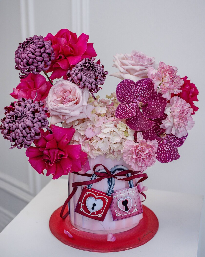 Decorative composition of light pink garden roses and white hydrangea