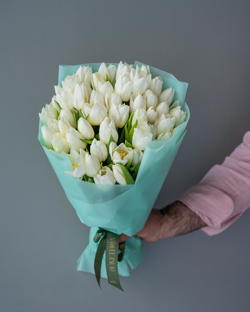 Fifty-one white tulips in waterproof paper