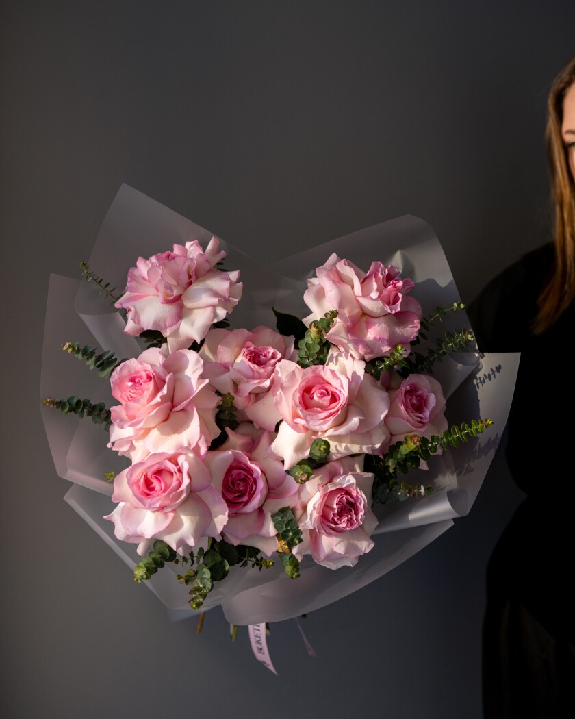 Nine light pink garden roses in waterproof paper