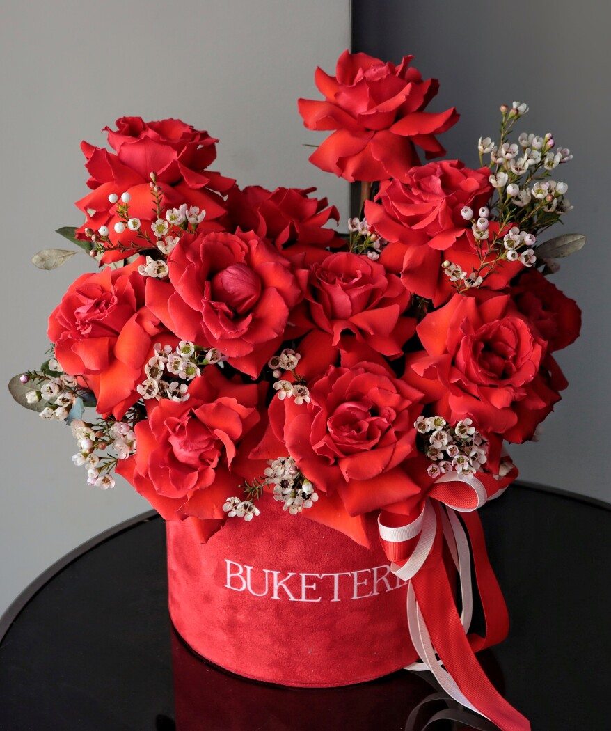 Eleven red hybrid tea roses in a luxury box