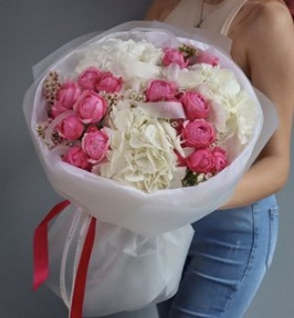 Mixed bouquet of white hydrangeas and hot pink spray roses