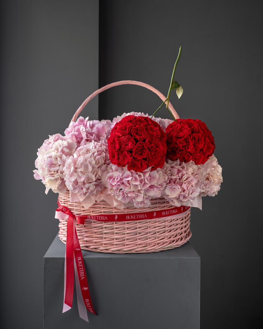 Pink hydrangeas with red spray roses