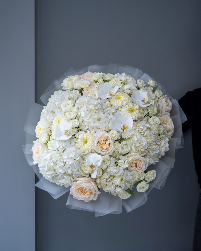 Thirteen peach spray roses with cream hydrangeas and blush garden roses