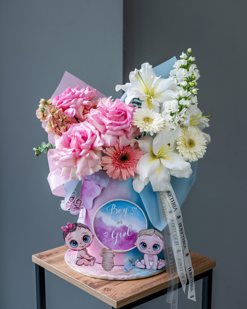 Decorative composition of blush garden roses and light pink gerberas