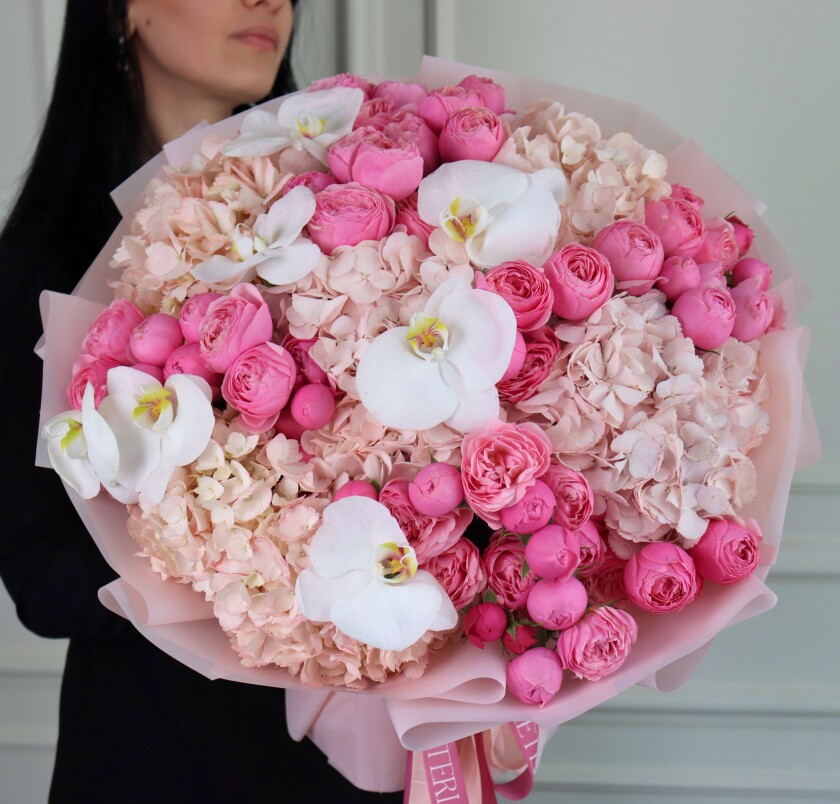 Hot pink spray roses with light pink hydrangeas and white orchids