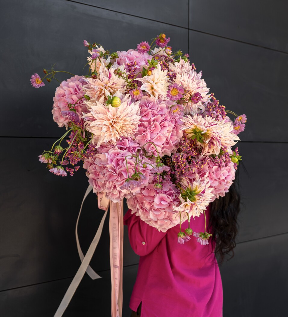Eleven blush cafe au lait dahlias with pink hydrangeas and cosmos