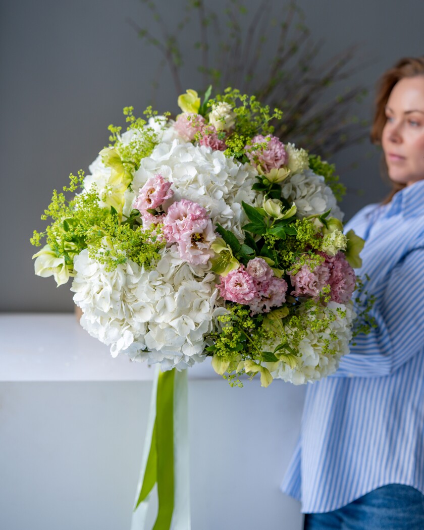 Mixed bouquet of white hydrangeas and dusty pink lisianthus