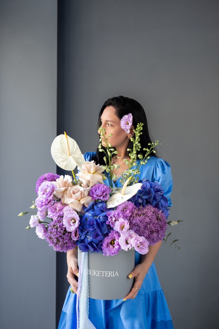 Two blue hydrangeas and three delphiniums in a box