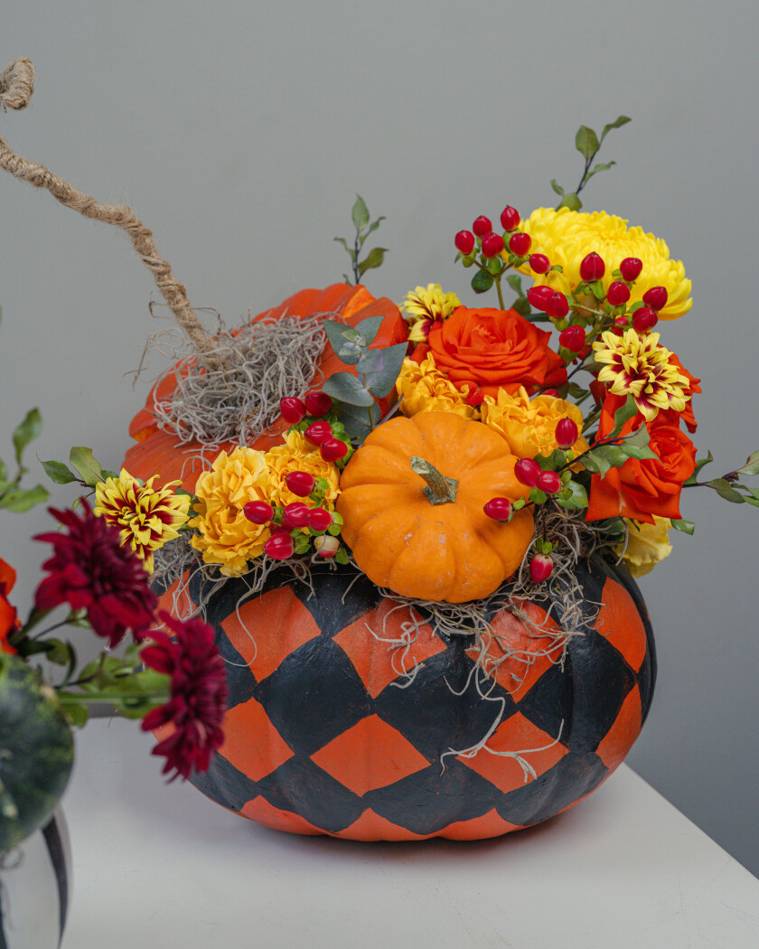 Orange garden roses with peach spray roses and yellow chrysanthemum