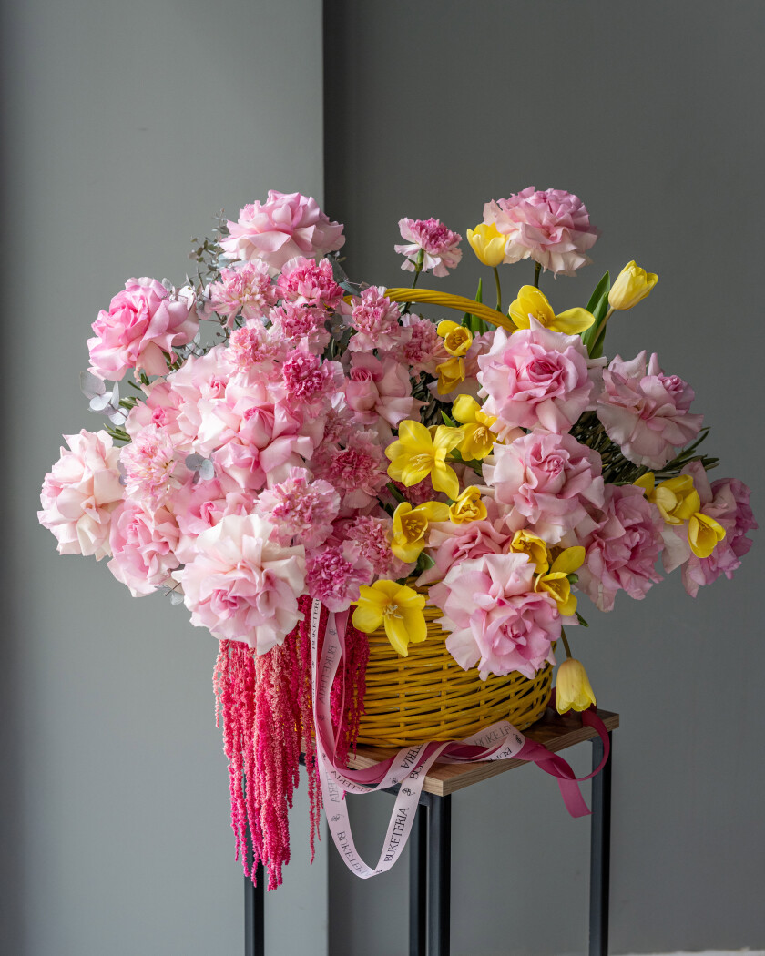 Spring bouquet of light pink garden roses and yellow tulips