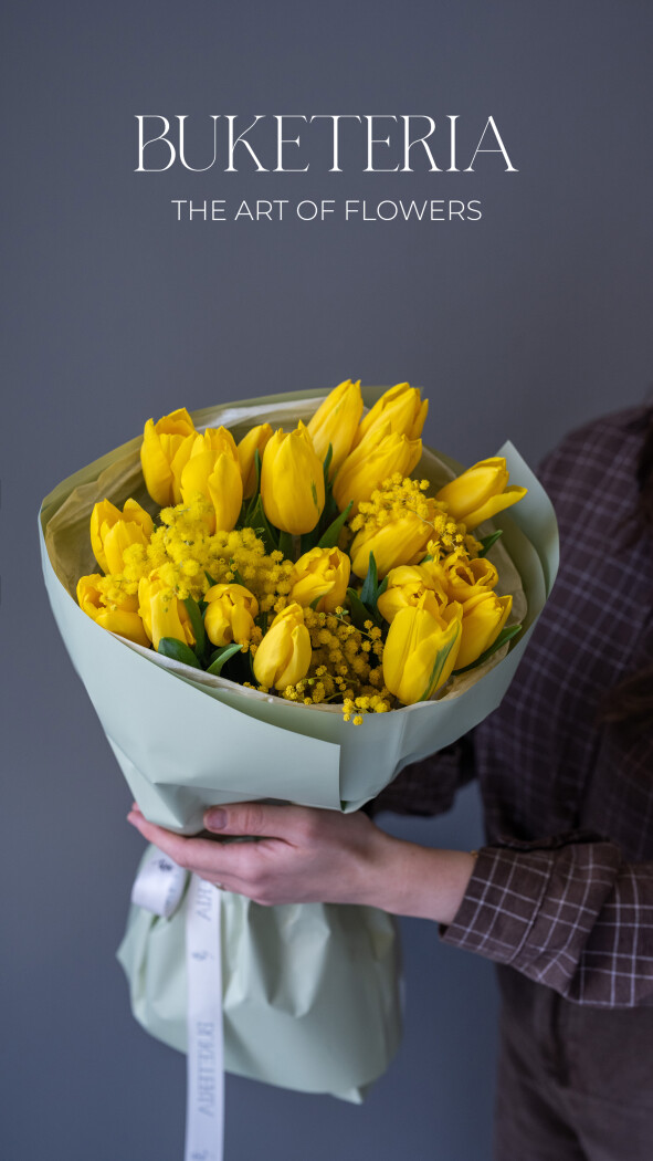 Spring bouquet of yellow tulips and mimosa