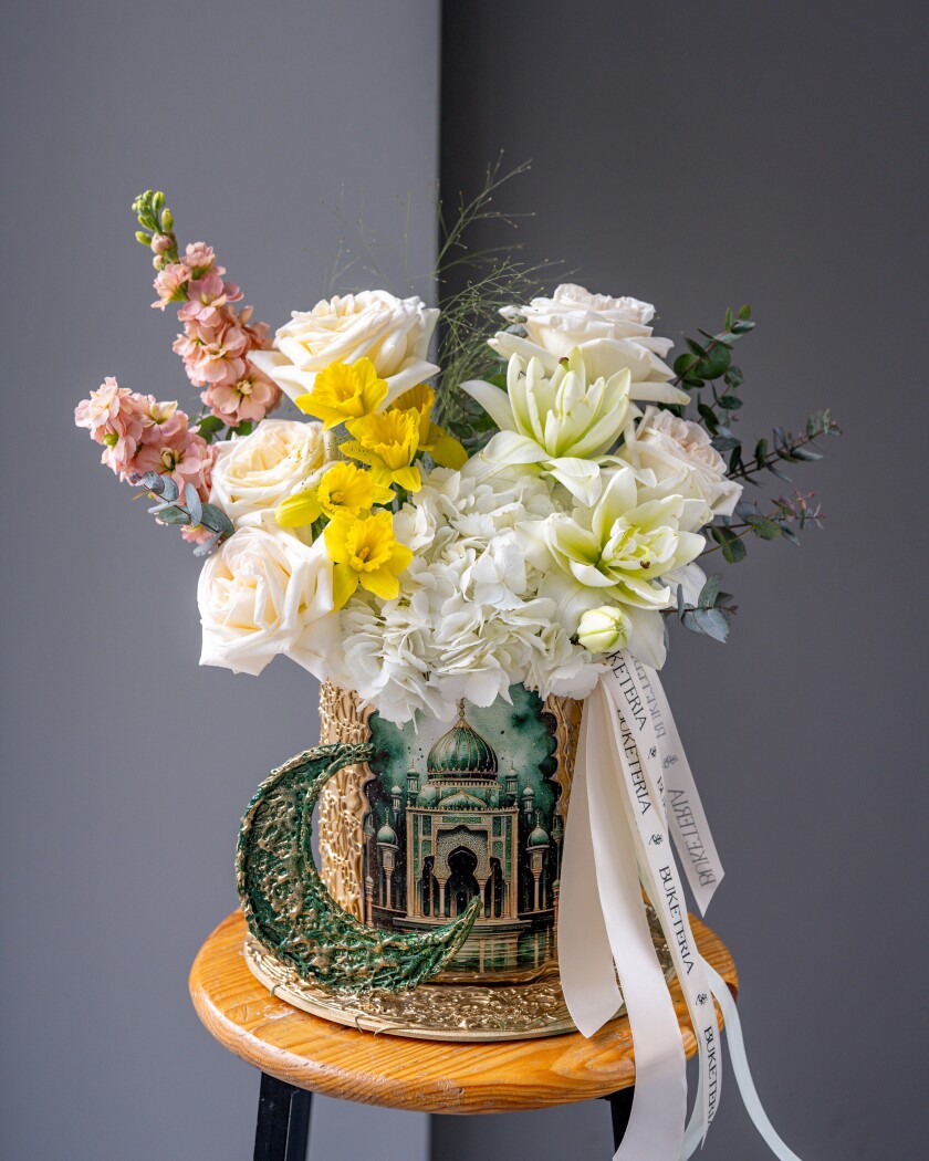 Decorative composition of blush garden roses and white hydrangeas