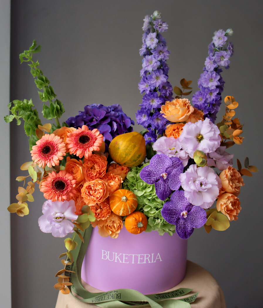 Coral gerberas with lavender orchids and lilac hydrangeas
