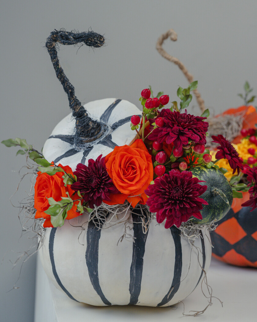 Autumn composition of orange roses and burgundy chrysanthemums