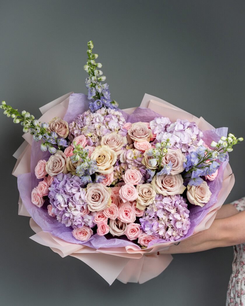 Thirteen dusty pink garden roses with lavender hydrangeas