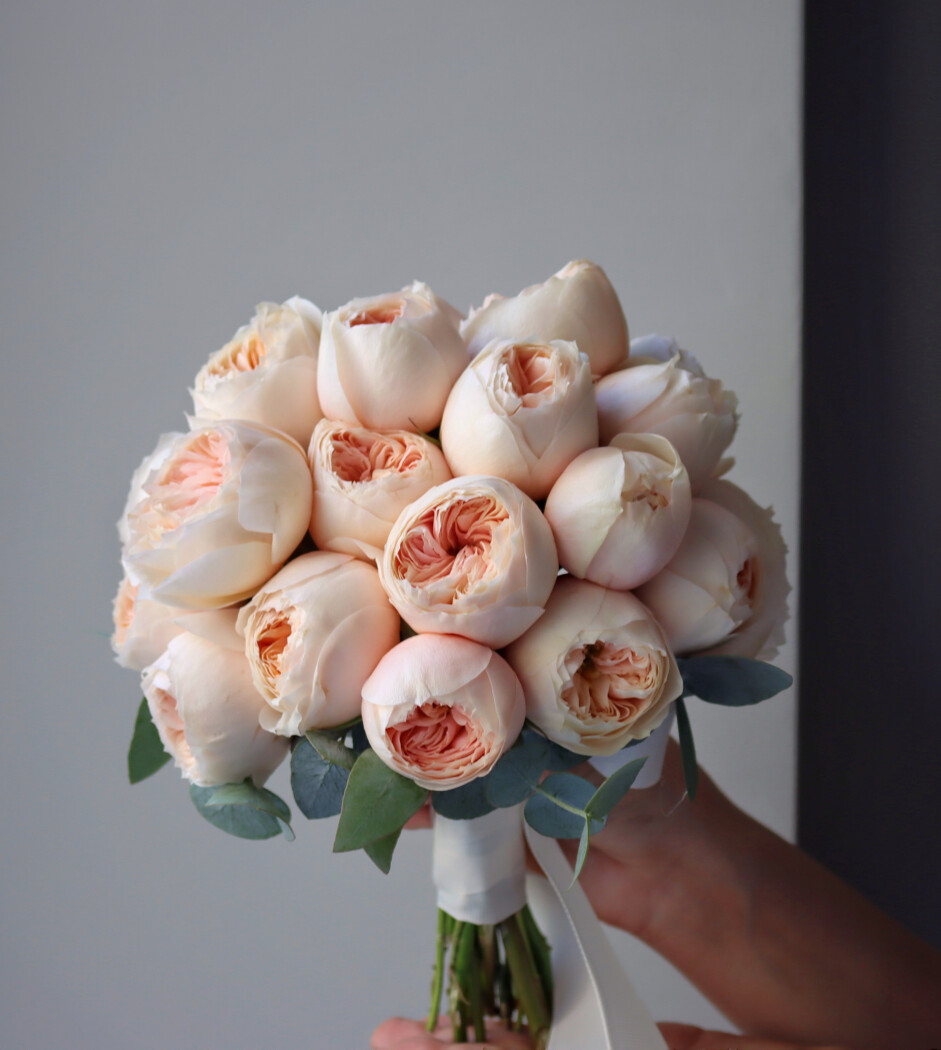 Nine peach spray roses in a romantic bouquet