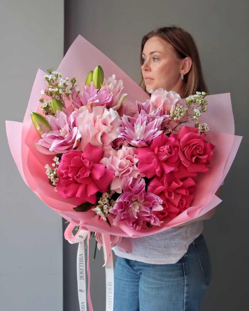 Seven hot pink garden roses and three light pink oriental lilies