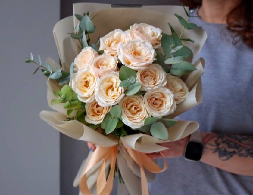 Peach spray roses in waterproof paper