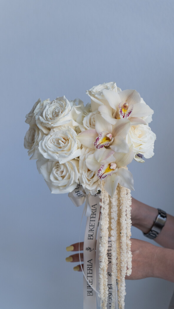 Thirteen cream roses with white cymbidium orchids