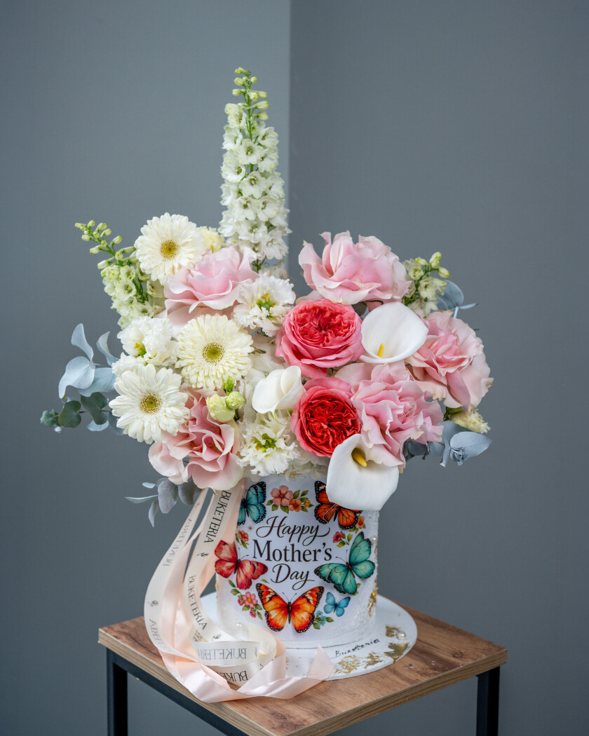 Decorative composition of pink garden roses with white callas