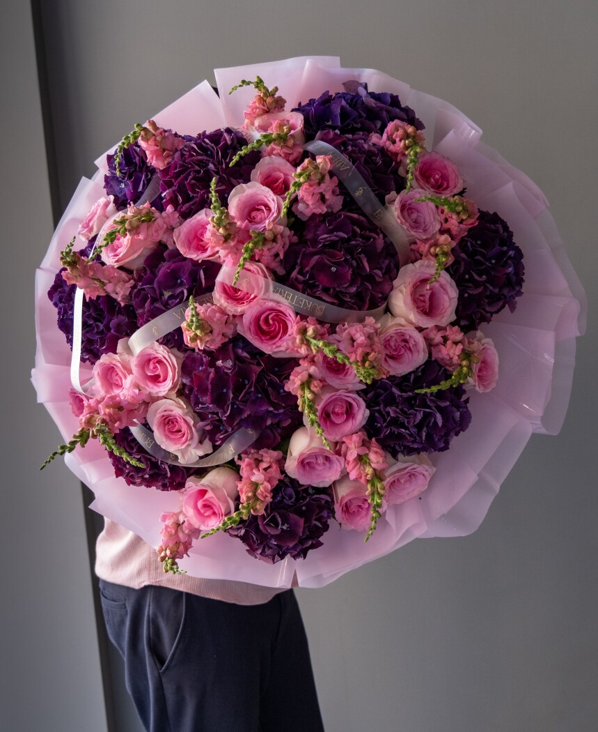 Mixed bouquet of lilac hydrangeas, blush garden roses, and pink snapdragons