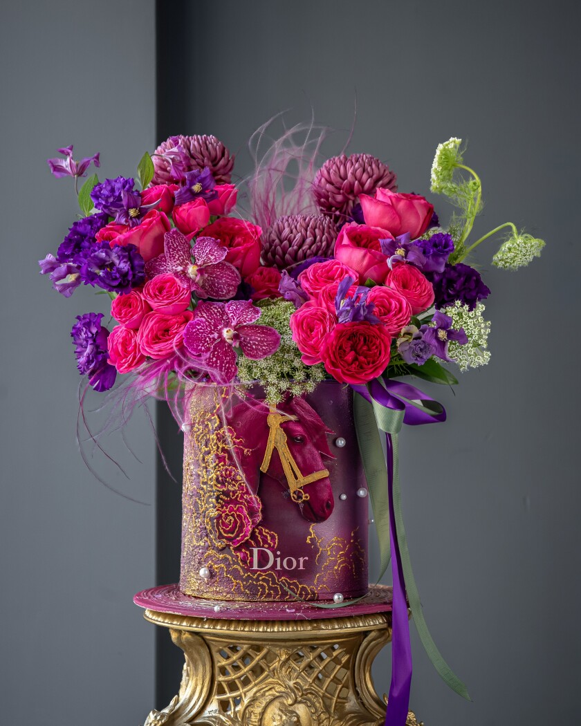 Decorative composition of pink garden roses and hot pink spray roses