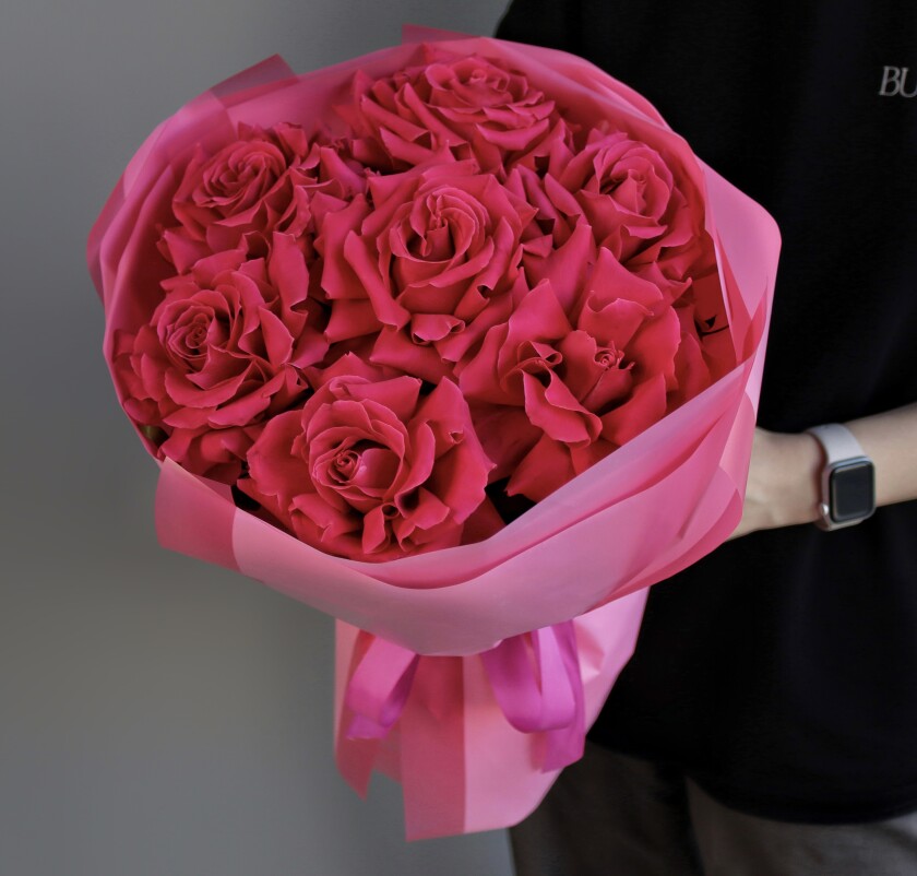 Seven hot pink garden roses in waterproof paper