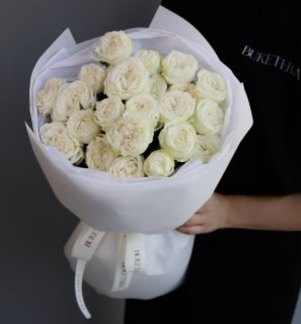 Six white spray roses in waterproof paper