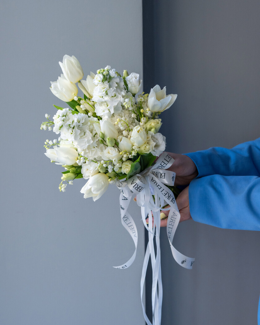 Ten white lily of the valley with tulips and lisianthus